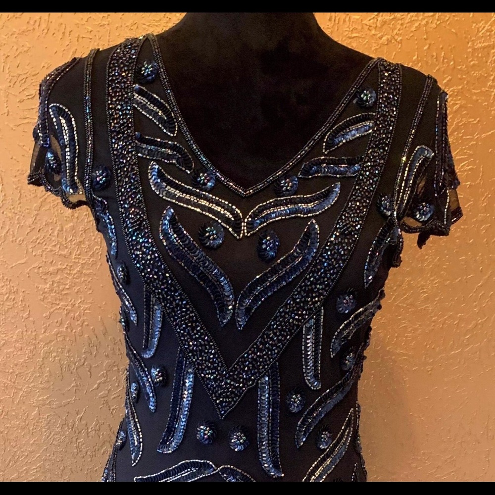 Chic; beaded 20’s influenced flapper dress.